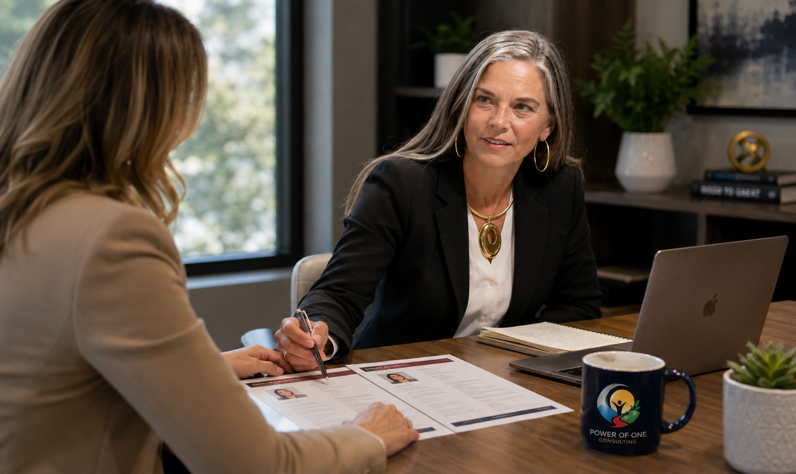 recruiting services image Leslie Moody discussing hiring strategy with business leaders