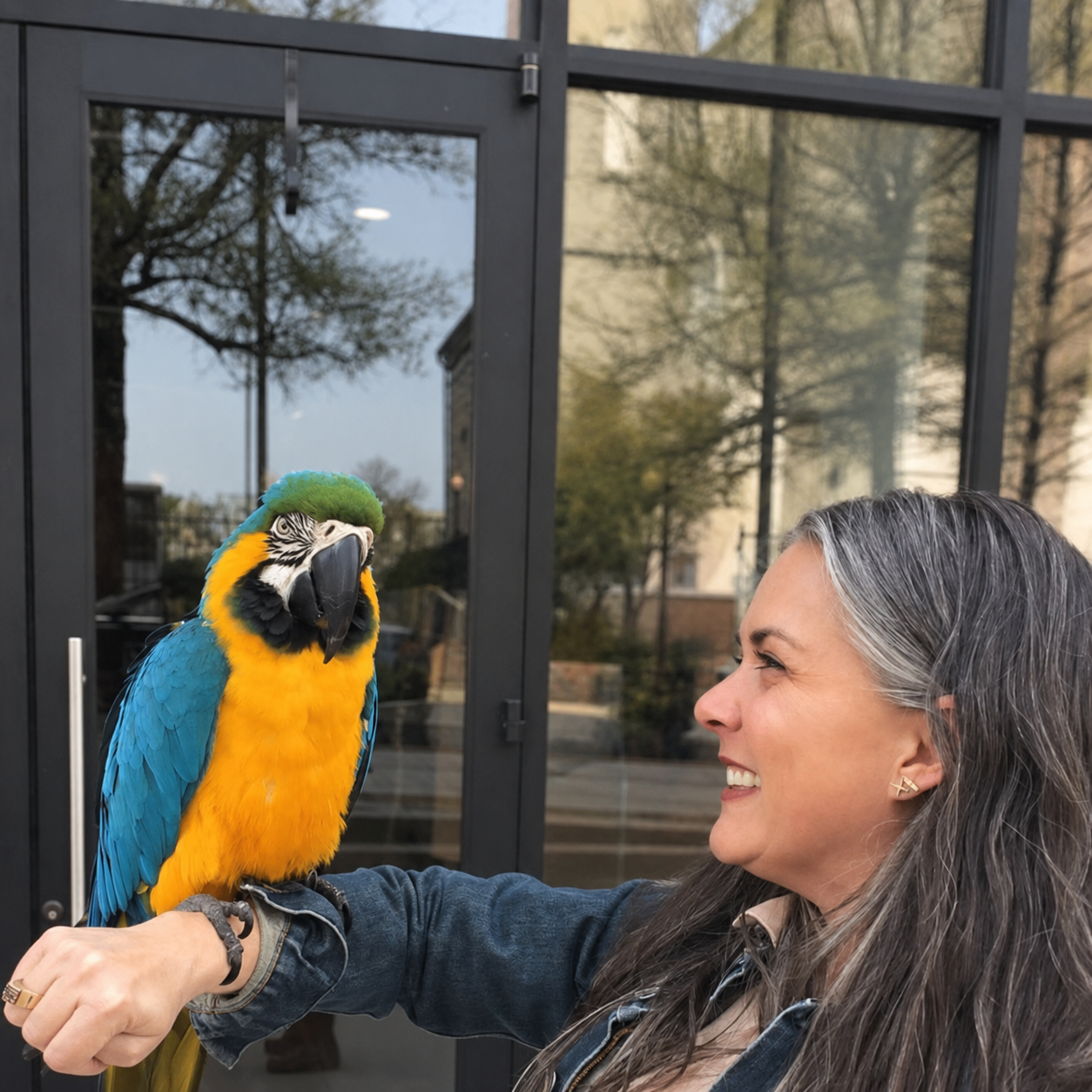 Leslie holding a parrot downtown